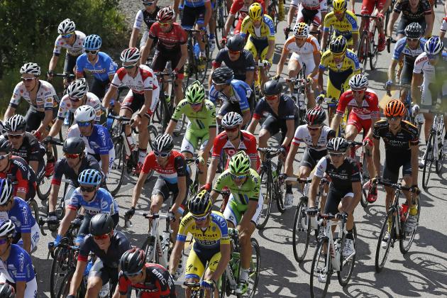 Riders climb a hill during the opening stage of the USA Pro Challenge bike race in Aspen, Colo. Monday Aug.18, 2014. The seven-stage race through the Colorado mountains finishes in Denver on Aug. 24. (AP Photo/Brennan Linsley)