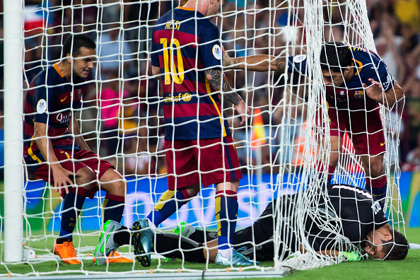 BARCELONA, SPAIN - AUGUST 17: Pedro Rodriguez (L), Lionel Messi (C) and Luis Suarez (R) of FC Barcelona try to take the ball from goalkeeper Gorka Iraizoz (bottom) of Athletic Club after Lionel Messi scored the opening goal during the Spanish Super Cup second leg match between FC Barcelona and Athletic Club at Camp Nou on August 17, 2015 in Barcelona, Spain. (Photo by Alex Caparros/Getty Images)