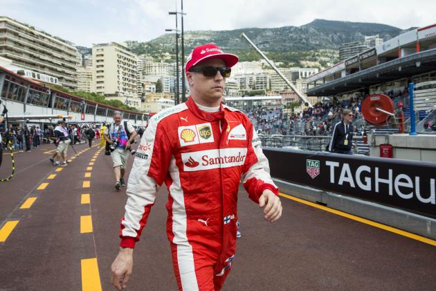 Ferrari driver Kimi Raikkonen of Finland walks through the pit lane after the first practice session at the Monaco racetrack, in Monaco, Thursday, May 21, 2015. The Formula One Grand Prix of Monaco will be held on Sunday. (AP Photo/Gero Breloer)