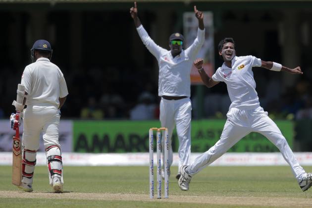 Sri Lanka's Dushmantha Chameera, right, celebrates the dismissal of India's Amit Mishra, left, during the second day's play play of their second test cricket match in Colombo, Sri Lanka, Friday, Aug. 21, 2015. (AP Photo/Eranga Jayawardena)