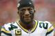 Green Bay Packers cornerback Jarrett Bush (24) looks on from the bench area during an NFL football game against the Tampa Bay Buccaneers on Sunday, Dec. 21, 2014, in Tampa, Fla. (AP Photo/Brian Blanco)