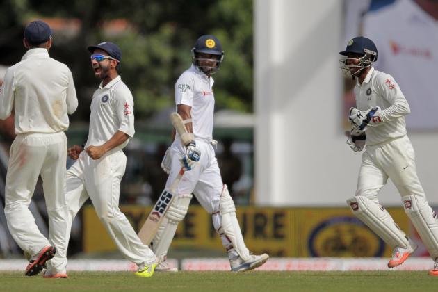 CORRECTS DATE - In this Friday, Aug. 21, 2015 photo, India's Ajinkya Rahane, second left, Virat Kohli, left, and Wriddhiman Saha, right, celebrate the dismissal of Sri Lanka's Kumar Sangakkara during the third day's play of the second test cricket match between them in Colombo, Sri Lanka. (AP Photo/Eranga Jayawardena)