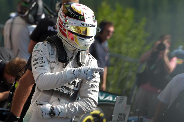 Mercedes AMG Petronas F1 Team's British driver Lewis Hamilton celebrates after taking the pole position in the parc ferme after the qualifying session at the Spa-Francorchamps ciruit in Spa on August 22, 2015, ahead of the Belgian Formula One Grand Prix. AFP PHOTO / ANDREJ ISAKOVIC        (Photo credit should read ANDREJ ISAKOVIC/AFP/Getty Images)