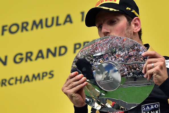 Third-placed Lotus F1 Team's French driver Romain Grosjean celebrates with his trophy on the podium at the Spa-Francorchamps circuit in Spa on August 23, 2015, after the Belgian Formula One Grand Prix. AFP PHOTO / ANDREJ ISAKOVIC (Photo credit should read ANDREJ ISAKOVIC/AFP/Getty Images)