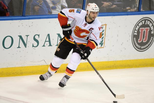 Calgary Flames' Mark Giordano (5) skates against the St. Louis Blues in a NHL hockey game, Saturday, Oct. 11, 2014, in St. Louis. (AP Photo/Bill Boyce)