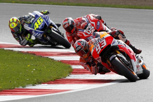 Repsol Honda Team rider Spanish Marc Marquez takes a turn with his Honda during the MotoGP race at the motorcycling British Grand Prix at Silverstone in Northamptonshire, southern England, on August 31, 2014. AFP PHOTO / IAN KINGTON (Photo credit should read IAN KINGTON/AFP/Getty Images)