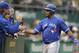 Toronto Blue Jays' Edwin Encarnacion is congratulated after hitting a home run off Oakland Athletics Kendall Graveman in the second inning of a baseball game Tuesday, July 21, 2015, in Oakland, Calif. (AP Photo/Ben Margot)