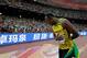 Jamaica's Usain Bolt bows to the crowd as he celebrates after winning the gold in the men's 200m final at the World Athletics Championships at the Bird's Nest stadium in Beijing, Thursday, Aug. 27, 2015. (AP Photo/Andy Wong)