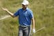 Jordan Spieth reacts after making his bunker shot on the 18th hole during the second round of the PGA Championship golf tournament Friday, Aug. 14, 2015, at Whistling Straits in Haven, Wis. (AP Photo/Chris Carlson)