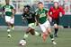 Jun 16, 2015; Tukwila, WA, USA; Seattle Sounders FC forward Obafemi Martins (9) dribbles away from Portland Timbers midfielder Jack Jewsbury (13) during the first half at Starfire Sports Complex. Mandatory Credit: Jennifer Buchanan-USA TODAY Sports