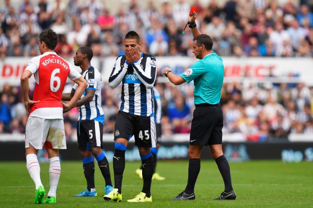 NEWCASTLE UPON TYNE, ENGLAND - AUGUST 29:  Aleksandar Mitrovic (2nd R) of Newcastle United is shown a red card by referee Andre Marriner (1st R) during the Barclays Premier League match between Newcastle United and Arsenal at St James' Park on August 29, 2015 in Newcastle upon Tyne, England.  (Photo by Stu Forster/Getty Images)
