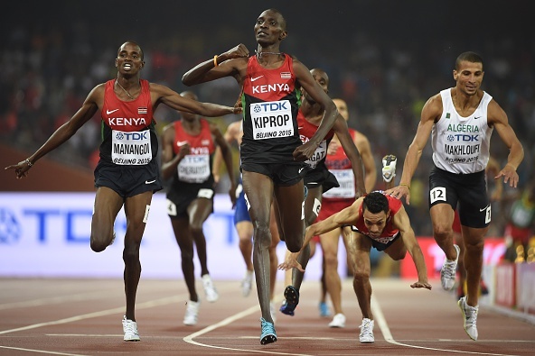 Kenya's Asbel Kiprop (C) reacts as he croses the finish line ahead of Kenya's Elijah Motonei Manangoi, Morocco's Abdalaati Iguider (lower) and Algeria's Taoufik Makhloufi in the final of the men's 1500 metres athletics event at the 2015 IAAF World Championships at the 'Bird's Nest' National Stadium in Beijing on August 30, 2015.  AFP PHOTO / OLIVIER MORIN        (Photo credit should read OLIVIER MORIN/AFP/Getty Images)