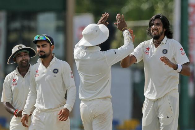 India's Ishant Sharma, right, celebrates the dismissal of Sri Lanka's Rangana Herath on the third day of their third test cricket match between them in Colombo, Sri Lanka, Sunday, Aug. 30, 2015. This was Sharma's fifth wicket. (AP Photo/Eranga Jayawardena)