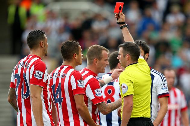 STOKE ON TRENT, ENGLAND - AUGUST 29:  Ibrahim Afellay (2nd L) of Stoke City is shown a red card by referee Michael Oliver (R) during the Barclays Premier League match between Stoke City and West Bromwich Albion at Britannia Stadium on August 29, 2015 in Stoke on Trent, England.  (Photo by Jan Kruger/Getty Images)