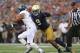 SOUTH BEND, IN - AUGUST 30: Jaylon Smith #9 of the Notre Dame Fighting Irish moves to tackle Darik Dillard #32 of the Rice Owls at Notre Dame Stadium on August 30, 2014 in South Bend, Indiana. Notre Dame defeated Rice 48-17. (Photo by Jonathan Daniel/Getty Images)