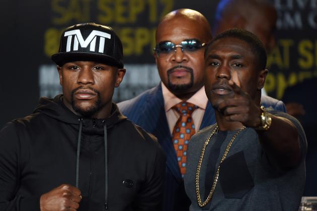 Boxers Floyd 'Money' Mayweather (L) and Andre Berto (R) face off during a press conference to officially announce their September 12 fight that will place at the MGM Grand Garden Arena in Las Vegas, at the Marriott Hotel in Los Angeles, California on August 6, 2015.  Mayweather claims it will be the last ever opportunity to see him fight.          AFP PHOTO / MARK RALSTON        (Photo credit should read MARK RALSTON/AFP/Getty Images)