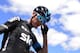 Sky's British cyclist Christopher Froome stands the third stage of the 2015 Vuelta Espana cycling tour, a 158.4km stage between Mijas and Malaga on August 24, 2015. AFP PHOTO/JOSE JORDAN (Photo credit should read JOSE JORDAN/AFP/Getty Images)
