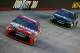 BRISTOL, TN - AUGUST 22: Kyle Busch, driver of the #18 Skittles Toyota, leads Denny Hamlin, driver of the #11 FedEx Ground Toyota, during the NASCAR Sprint Cup Series IRWIN Tools Night Race at Bristol Motor Speedway on August 22, 2015 in Bristol, Tennessee. (Photo by Brian Lawdermilk/Getty Images)
