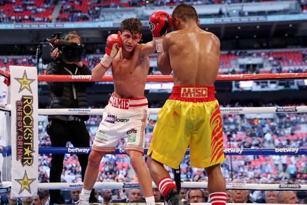 LONDON, ENGLAND - MAY 31:  Jamie McDonnell in action with Tabtimdaeng Na Rachawat during their Vacant WBA World Bantamweight Championship bout at Wembley Stadium on May 31, 2014 in London, England.  (Photo by Scott Heavey/Getty Images)