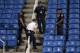 NEW YORK, NY - SEPTEMBER 03: Police stand guard next to a drone after it crashed into the stands in Louis Armstrong Stadium during the during their Women's Singles Second Round match between Flavia Pennetta of Italy and Monica Niculescu of Romania on Day Four of the 2015 US Open at the USTA Billie Jean King National Tennis Center on September 3, 2015 in the Flushing neighborhood of the Queens borough of New York City. (Photo by Matthew Stockman/Getty Images)