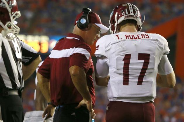Sep 5, 2015; Gainesville, FL, USA; New Mexico State Aggies head coach Doug Martin talks with quarterback Tyler Rogers (17) against the Florida Gators during the second half at Ben Hill Griffin Stadium. Mandatory Credit: Kim Klement-USA TODAY Sports