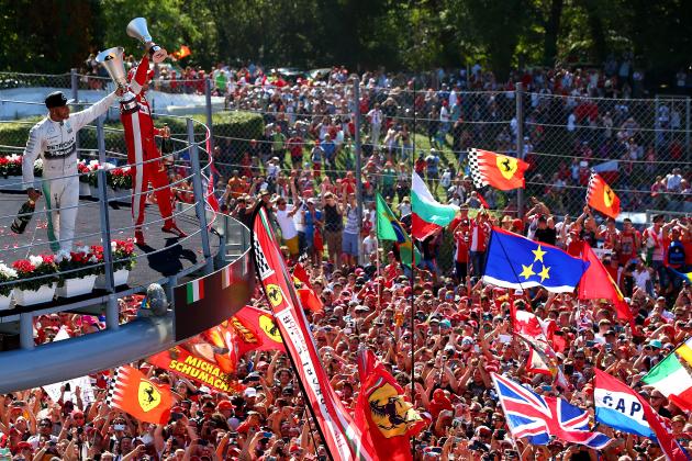 MONZA, ITALY - SEPTEMBER 06:  Lewis Hamilton of Great Britain and Mercedes GP celebrates on the podium next to Sebastian Vettel of Germany and Ferrari after winning the Formula One Grand Prix of Italy at Autodromo di Monza on September 6, 2015 in Monza, Italy.  (Photo by Mark Thompson/Getty Images)
