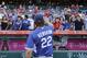 Los Angeles Dodgers starting pitcher Clayton Kershaw tosses the ball back to his fans before a baseball game with the Los Angeles Angels, Monday, Sept. 7, 2015, in Anaheim, Calif. (AP Photo/Jae C. Hong)