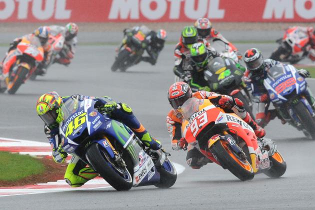 Italy’s Valentino Rossi of Movistar Yamaha, left, takes a corner during the Moto GP race at the British Grand Prix at Silverstone, England, Sunday, Aug. 30, 2015. Rossi went on to win the race. (AP Photo/Rui Vieira)