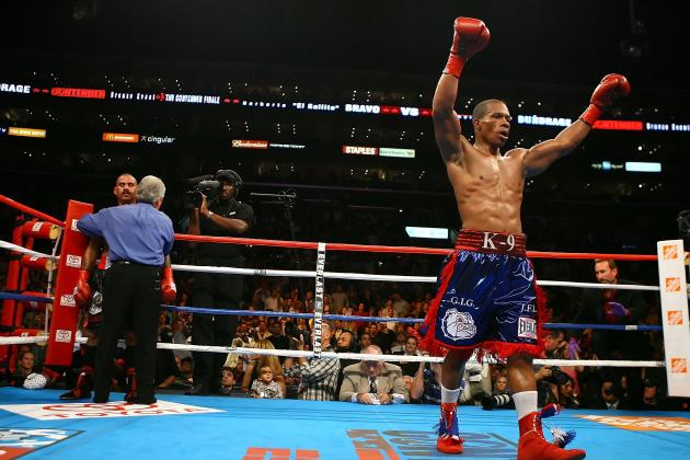 LOS ANGELES, CA - SEPTEMBER 26:  Cornelius Bundrage (R) raises his arms in victory as referee Pat Russell holds back Norberto Bravo in the corner and calls the fight in the 7th round during their bronze bout at the 'The Contender' Season Two Finale at Staples Center on September 26, 2006 in Los Angeles, California. Bundrage won after the fight was stopped in the 7th round.  (Photo by Al Bello/Getty Images)