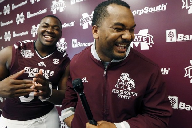 Mississippi State defensive lineman Chris Jones, left, jokes with offensive lineman Rufus Warren who acted as a