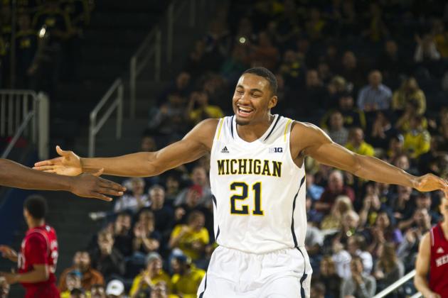 Michigan guard Zak Irvin (21) celebrates after making successive three point baskets, in the first half of an NCAA college basketball game against Nebraska at Crisler Center in Ann Arbor, Mich., Wednesday, Feb. 5, 2014. (AP Photo/Tony Ding)