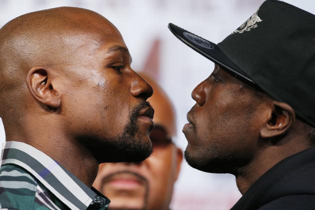 Floyd Mayweather Jr., left, and Andre Berto pose for photographers during a news conference Wednesday, Sept. 9, 2015, in Las Vegas. The two are scheduled to fight Saturday in Las Vegas. (AP Photo/John Locher)