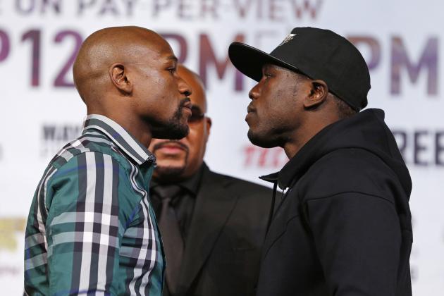 Floyd Mayweather Jr., left, and Andre Berto pose for photographers during a news conference Wednesday, Sept. 9, 2015, in Las Vegas. The two are scheduled to fight Saturday in Las Vegas. (AP Photo/John Locher)