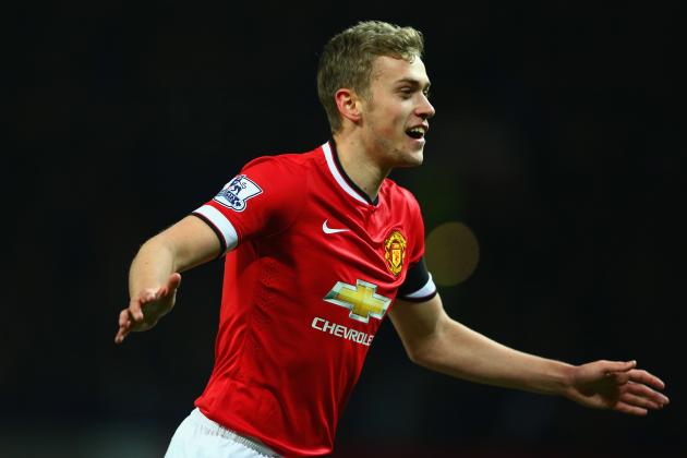 MANCHESTER, ENGLAND - FEBRUARY 03: James Wilson of Manchester United celebrates scoring their third goal during the FA Cup Fourth round replay match between Manchester United and Cambridge United at Old Trafford on February 3, 2015 in Manchester, England. (Photo by Clive Mason/Getty Images)