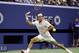 Roger Federer, of Switzerland, returns a shot to Stan Wawrinka, of Switzerland, during a semifinal match at the U.S. Open tennis tournament, Friday, Sept. 11, 2015, in New York. (AP Photo/David Goldman)