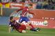 Atletico Madrid’s Fernando Torres, right, shoots past Barcelona’s Thomas Vermaelen during a Spanish La Liga soccer match between Atletico Madrid and Barcelona at the Vicente Calderon stadium in Madrid, Spain, Saturday Sept. 12, 2015. (AP Photo/Paul White)