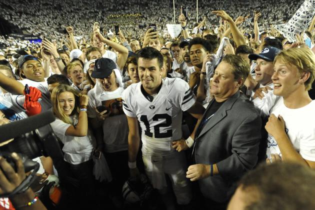 PROVO, UT - SEPTEMBER 12: Quarterback Tanner Mangum #12 of the Brigham Young Cougars is surrounded by fans on the field after their 35-24 win over the Boise State Broncos at LaVell Edwards Stadium on September 12, 2015 in Provo, Utah. (Photo by Gene Sweeney Jr/Getty Images)