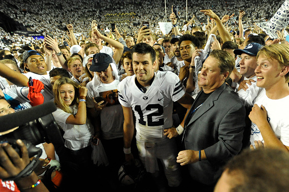 PROVO, UT - SEPTEMBER 12: Quarterback Tanner Mangum #12 of the Brigham Young Cougars is surrounded by fans on the field after their 35-24 win over the Boise State Broncos at LaVell Edwards Stadium on September 12, 2015 in Provo, Utah. (Photo by Gene Sweeney Jr/Getty Images)