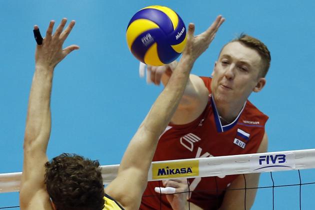 Alexey Spiridonov of Russia spikes the ball against Brazil during their match in the men's volleyball World Grand Champions Cup in Tokyo, Saturday, Nov. 23, 2013. (AP Photo/Koji Sasahara)