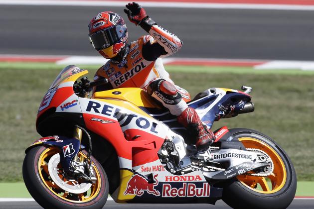 Honda rider Marc Marquez, of Spain, waves to supporters at the end of a practice session for Sunday's San Marino Moto GP, at the Misano circuit, in Misano Adriatico, Italy, Saturday, Sept. 12, 2015. (AP Photo/Antonio Calanni)