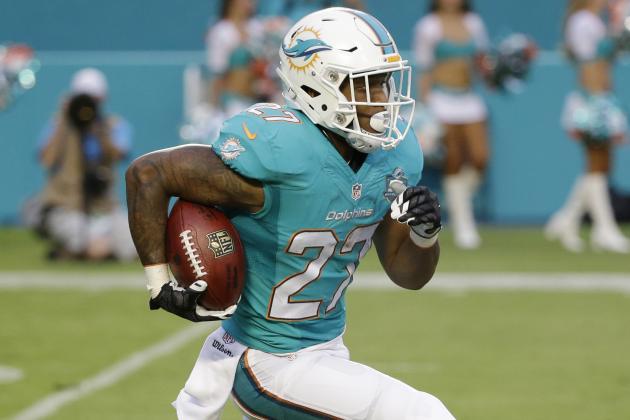 Miami Dolphins running back LaMichael James (27) carries the ball during the first half of an NFL pre season football game against the Atlanta Falcons, Saturday, Aug. 29, 2015 in Miami Gardens, Fla. (AP Photo/Wilfredo Lee)