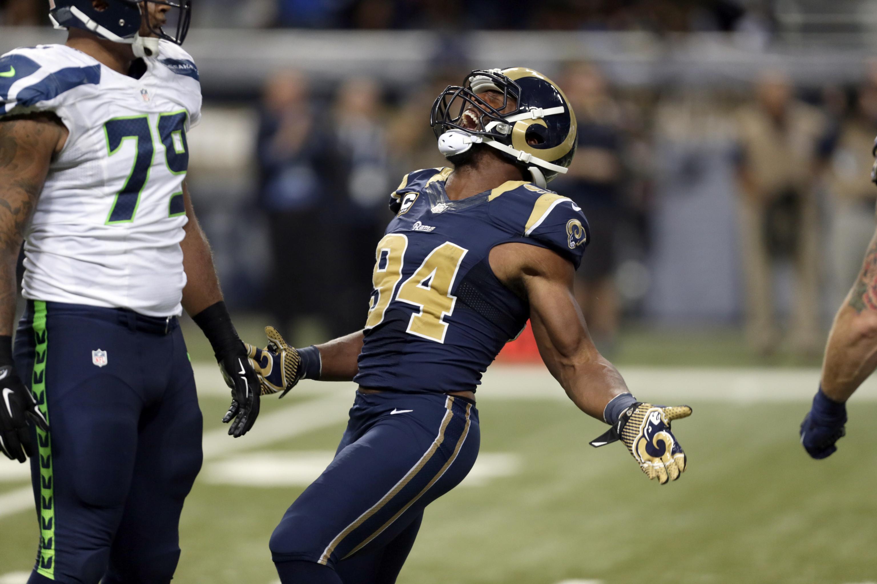 Rams' Robert Quinn returns from injury, helps out with presence