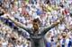 Real Madrid's Cristiano Ronaldo celebrates after scoring against Espanyol during a Spanish La Liga soccer match at Cornella-El Prat stadium in Cornella Llobregat, Spain, Saturday, Sept. 12, 2015. (AP Photo/Manu Fernandez)