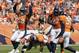 Denver Broncos outside linebacker Von Miller (58), DeMarcus Ware (94), Malik Jackson (97) and David Bruton (30) celebrate a a sack on Baltimore Ravens quarterback Joe Flacco during an NFL football game between the Denver Broncos and the Baltimore Ravens Sunday, Sept. 13, 2015, in Denver. Denver beat Baltimore 19-13. (AP Photo/Jack Dempsey)