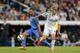 Real Madrid's Martin Odegaard from Norway, right, duels for the ball with Getafe's Lacen, during a Spanish La Liga soccer match between Real Madrid and Getafe at the Santiago Bernabeu stadium in Madrid, Spain, Saturday, May 23, 2015. (AP Photo/Daniel Ochoa de Olza)