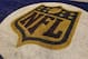 An NFL logo is seen during the first half of an NFL preseason football game between the Indianapolis Colts and the Cincinnati Bengals Thursday, Sept. 3, 2015, in Indianapolis. (AP Photo/Michael Conroy)