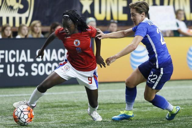 DETROIT, MI - SEPTEMBER 17: Nerilia Mondesir #9 of Haiti tries to drive past Meghan Klingenberg #22 of the United States during the first half of the U.S. Women's 2015 World Cup victory tour match at Ford Field on September 17, 2015, in Detroit, Michigan. (Photo by Duane Burleson/Getty Images)