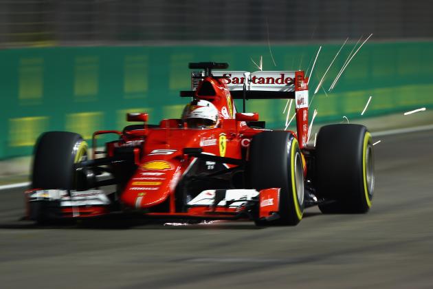 SINGAPORE - SEPTEMBER 19:  Sebastian Vettel of Germany and Ferrari drives during qualifying for the Formula One Grand Prix of Singapore at Marina Bay Street Circuit on September 19, 2015 in Singapore.  (Photo by Clive Mason/Getty Images)