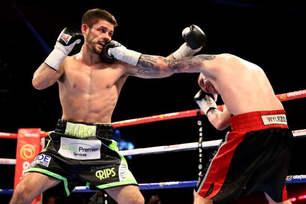 SHEFFIELD, ENGLAND - MARCH 28: Stephen Smith (L) of Great Britain lands a blow on Jacek Wylezol of Poland during a super featherweight contest at Motorpoint Arena on March 28, 2015 in Sheffield, England. (Photo by Richard Heathcote/Getty Images)
