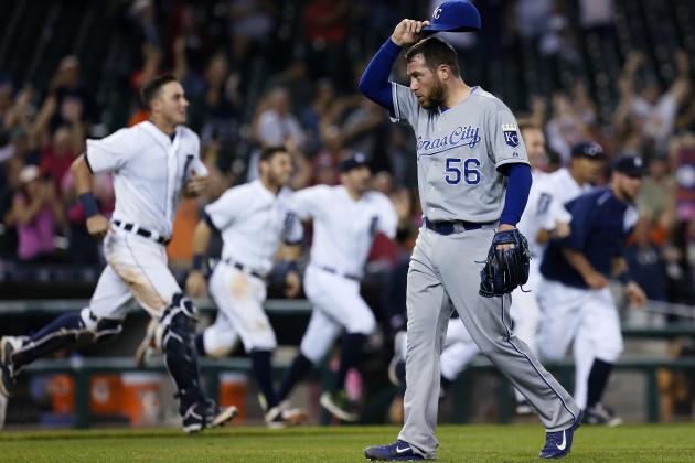 Kansas City Royals pitcher Greg Holland (56) walks off the field after giving up a game-winning RBI single to Detroit Tigers' Dixon Machado during the 12th inning of a baseball game Friday, Sept. 18, 2015, in Detroit. The Tigers defeated the Royals 5-4. (AP Photo/Duane Burleson)
